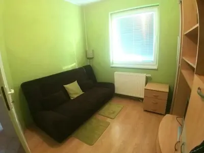 a living room with a couch and a window at Haus mit großen Garten in Modriča