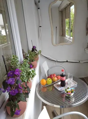 a table with fruits and vegetables on a balcony at Apartman Nova Varos in Banja Luka