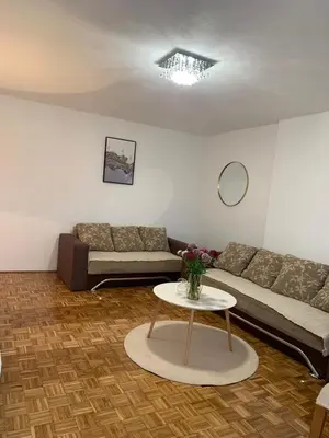 a living room with a couch and a table at Apartman Nova Varos in Banja Luka