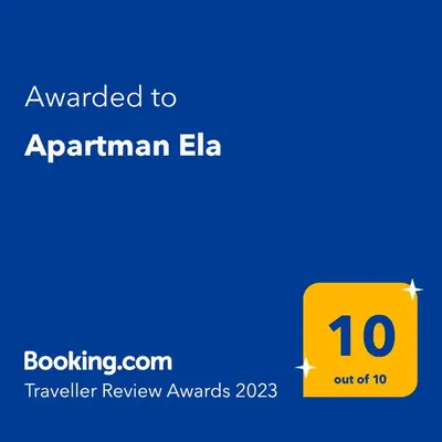 a yellow sign with the text awarded to armenian ela at Apartman Ela in Banja Luka