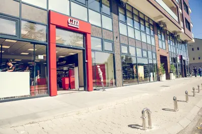 an empty street in front of a building at Apartmani SL Luxury in Banja Luka