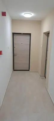 an empty room with a garage door in a building at Zidart lux in Pištelići