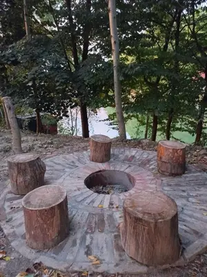 a group of logs sitting on top of a fire pit at Magaze de Luxe in Gradačac