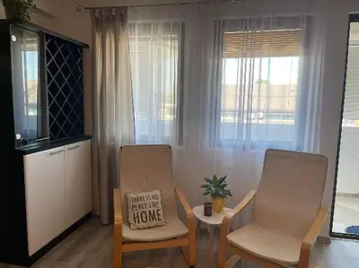 a living room with two chairs and a table at Bajka centar in Bosanska Gradiška