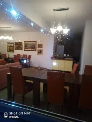 a dining room with a table and chairs at Vila Zvizdic- apartman in Ilijaš