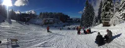 a group of people on a snow covered ski slope at Apartman Nancy Vlašić in Vlasic