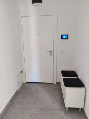a room with a door and a bench and a door at Yellow Submarine apartment Banja Luka in Banja Luka