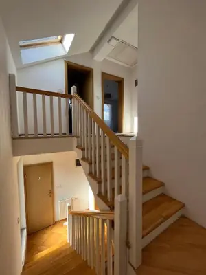 a staircase in a house with a skylight at Sunrise Apartment in Visoko