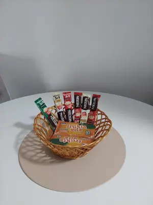 a basket of food sitting on top of a table at Sunrise Apartments in Banja Luka