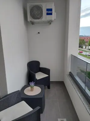 a room with a heater and a chair and a window at Sunrise Apartments in Banja Luka