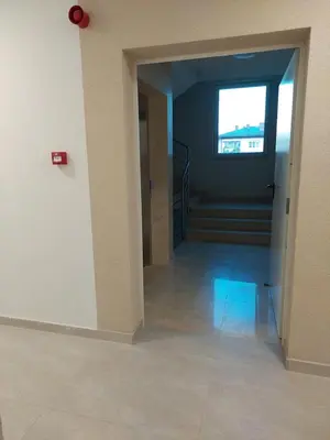 an empty room with a hallway with a window at Sunrise Apartments in Banja Luka