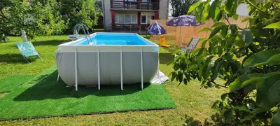 a large white tub sitting on the grass in a yard at Begova kuća-Velika Kladuša in Velika Kladuša