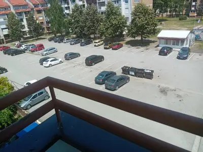 a view of a parking lot from a balcony at Apartman Vesna in Doboj