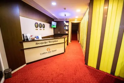 a corridor of a hospital with a reception desk at Boutique Hotel Golden Star in Tuzla