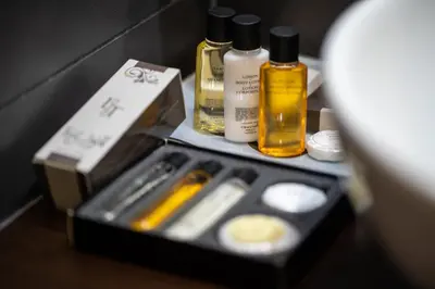 two bottles of essential oils sitting on a table at Boutique Hotel Golden Star in Tuzla