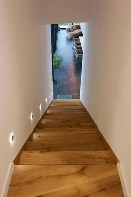 a staircase in a house with wood floors at Villa Wineyard - VinoGrad in Banja Luka