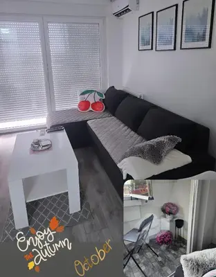 a living room with a couch and a table at XENA Centar Gradiška in Bosanska Gradiška