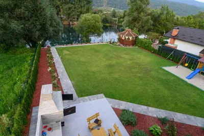 an aerial view of a large yard with a playground at Summer Residence Una in Bihać