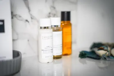 two bottles of essential oils sitting on a counter at Hotel Laktaši in Laktaši