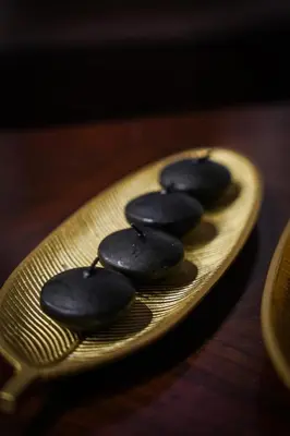a plate of chocolate cookies on a wooden table at Hotel Laktaši in Laktaši