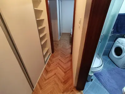 a small bathroom with a toilet and a closet at Apartment Alex in Banja Luka
