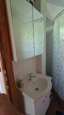 a bathroom with a sink and a mirror at Kuća u šumi - Forest house near National park Una - Air Spa Lohovo in Bihać