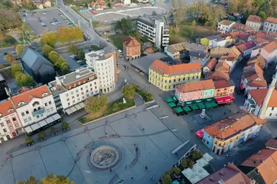an aerial view of a city with buildings at Square Studio Tuzla in Tuzla