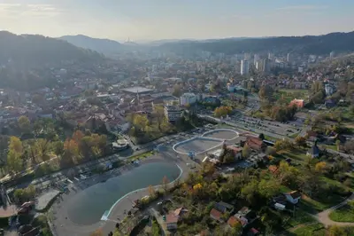 an aerial view of a city with a tennis court at Square Studio Tuzla in Tuzla