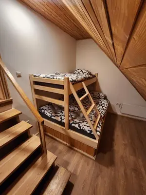 two bunk beds in a room with a staircase at Holiday home Maša - Kupres in Kupres