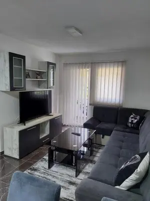a living room with a couch and a table at MALM Travnik in Travnik