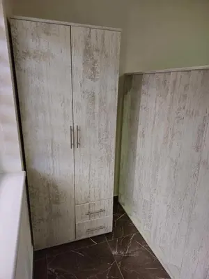 a pair of wooden cabinets in a room at MALM Travnik in Travnik