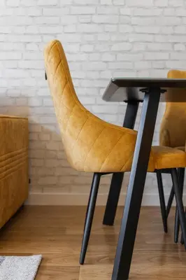 a chair sitting at a desk with a table at Comfort Lux Residence in Banja Luka
