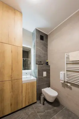 a bathroom with a white toilet and a sink at Comfort Lux Residence in Banja Luka