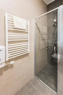 a shower with a glass door in a bathroom at Comfort Lux Residence in Banja Luka