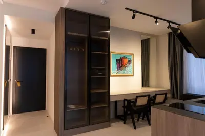 a kitchen and dining room with a black cabinet at Hotel Adriale in Kreševo