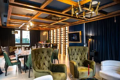 a dining room with a table and chairs at Hotel Adriale in Kreševo