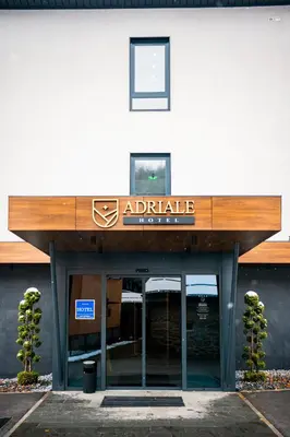 a building with a sign that reads adelaide at Hotel Adriale in Kreševo