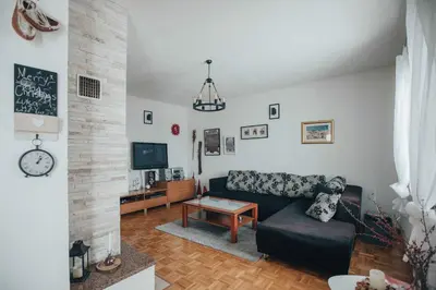 a living room with a couch and a table at Rosa Canina Kupres in Kupres
