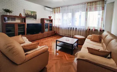 a living room with two couches and a television at Heart of the City in Banja Luka