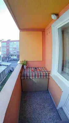 a balcony with a bench on the side of a building at Heart of the City in Banja Luka