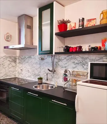 a kitchen with green cabinets and a sink at Heart of the City in Banja Luka