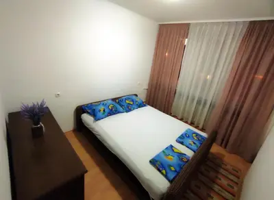 a small bedroom with a bed and a window at Heart of the City in Banja Luka