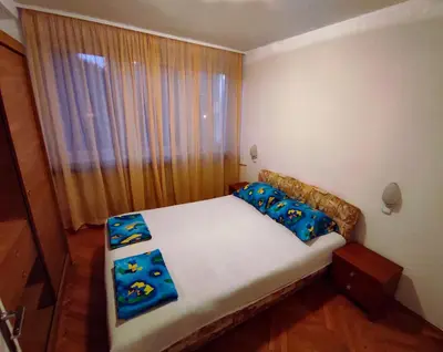 a small bed in a room with a window at Heart of the City in Banja Luka