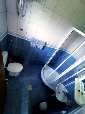 a bathroom with a toilet and a sink and a mirror at Motel Gas-Petrol Samac in Bosanski Šamac