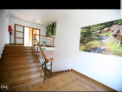 a staircase in a house with a painting on the wall at Vlašićka ruža Eko FIS 303 in Vlasic