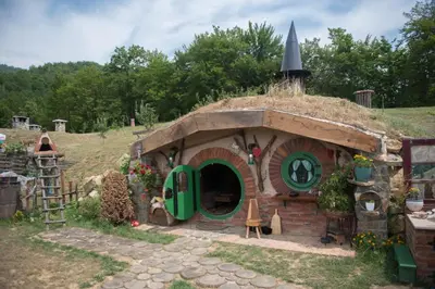 a small house with a turf roof with aire at Zemljane kućice Kreševo in Kreševo
