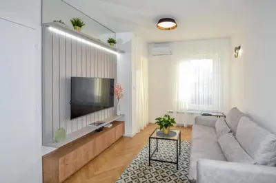 a living room with a couch and a flat screen tv at Apartman Filip in Banja Luka
