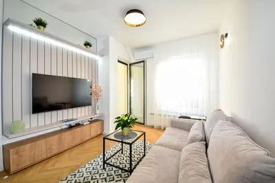 a living room with a couch and a flat screen tv at Apartman Filip in Banja Luka