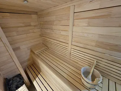 a inside of a sauna with a toilet in it at Hotel ETNA in Gračanica