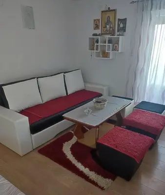 a living room with a couch and a table at Vikendica Cokori in Banja Luka